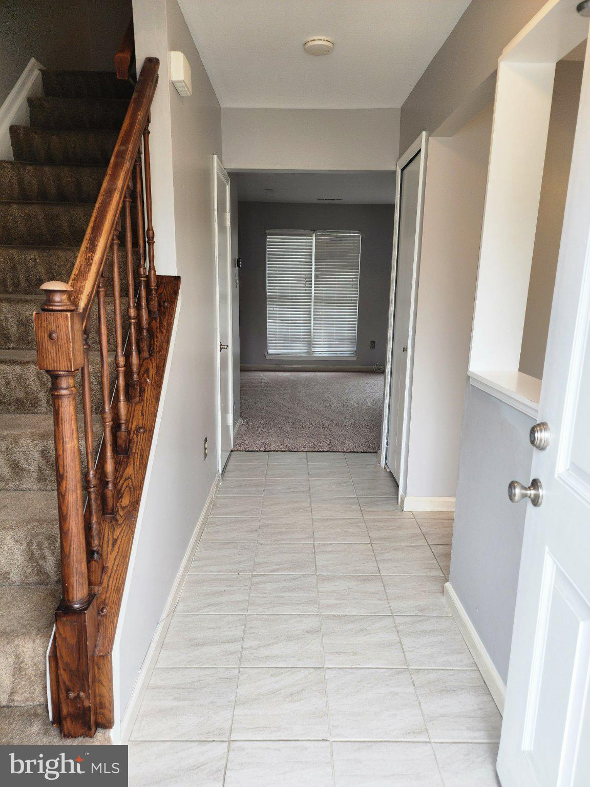 2384 Mitchellville Road Bowie, MD 20716 - Photo 3 of 44 a view of staircase with white walls and a window