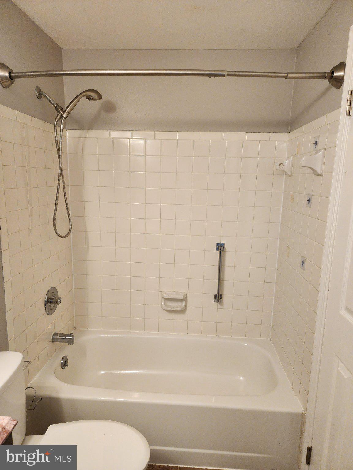 2384 Mitchellville Road Bowie, MD 20716 - Photo 34 of 44 a bathroom with a shower a toilet and a shower