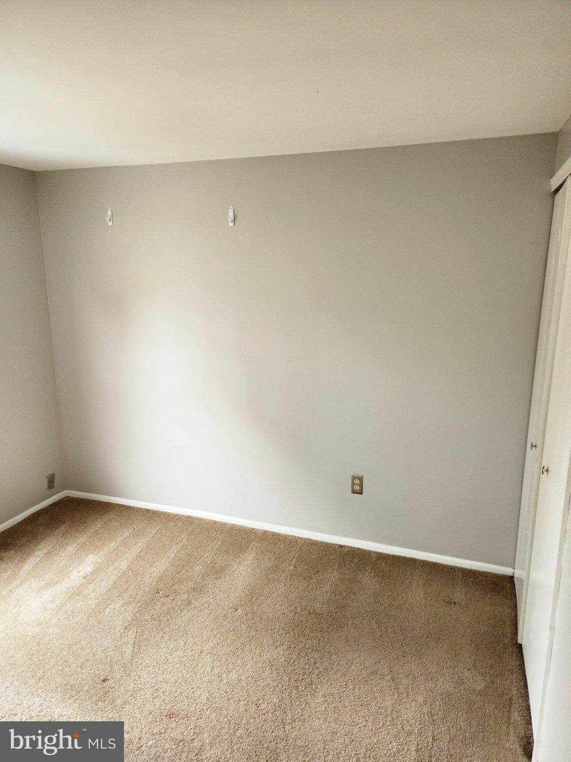 2384 Mitchellville Road Bowie, MD 20716 - Photo 40 of 44 an empty room with a bench