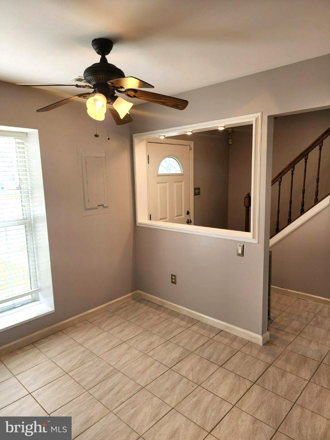 2384 Mitchellville Road Bowie, MD 20716 - Photo 5 of 44 a view of a livingroom with wooden floor and a ceiling fan