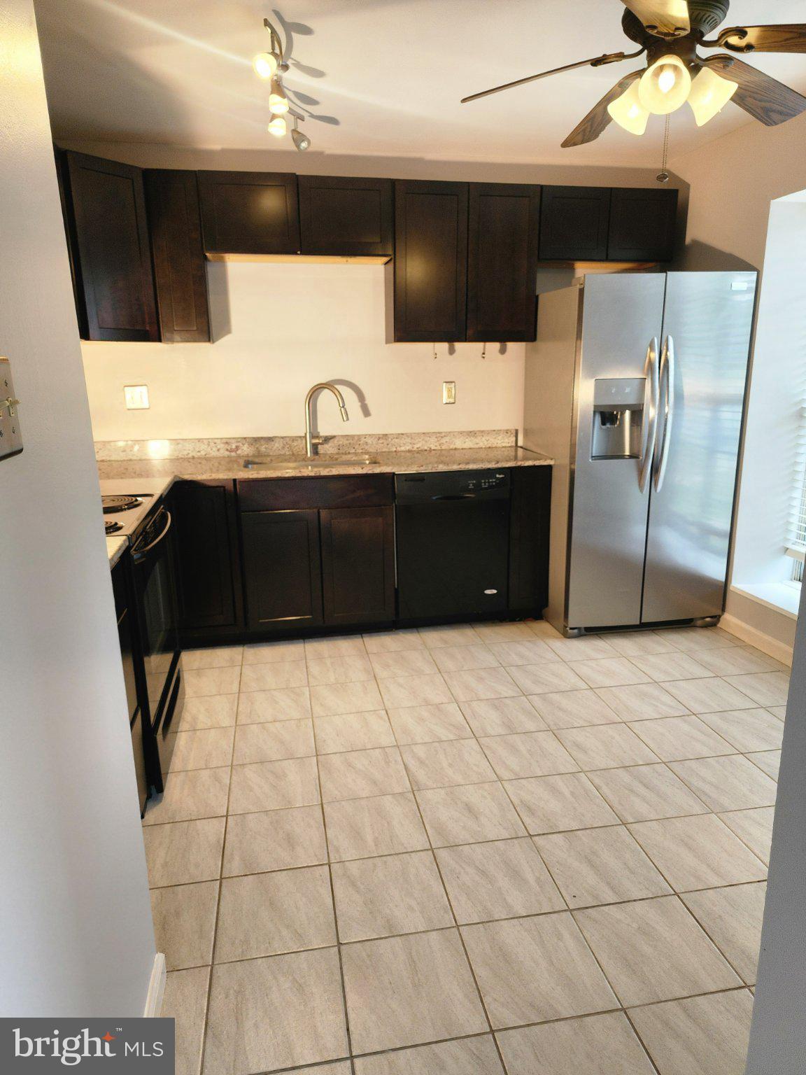 2384 Mitchellville Road Bowie, MD 20716 - Photo 8 of 44 a bathroom with a sink a vanity and a mirror