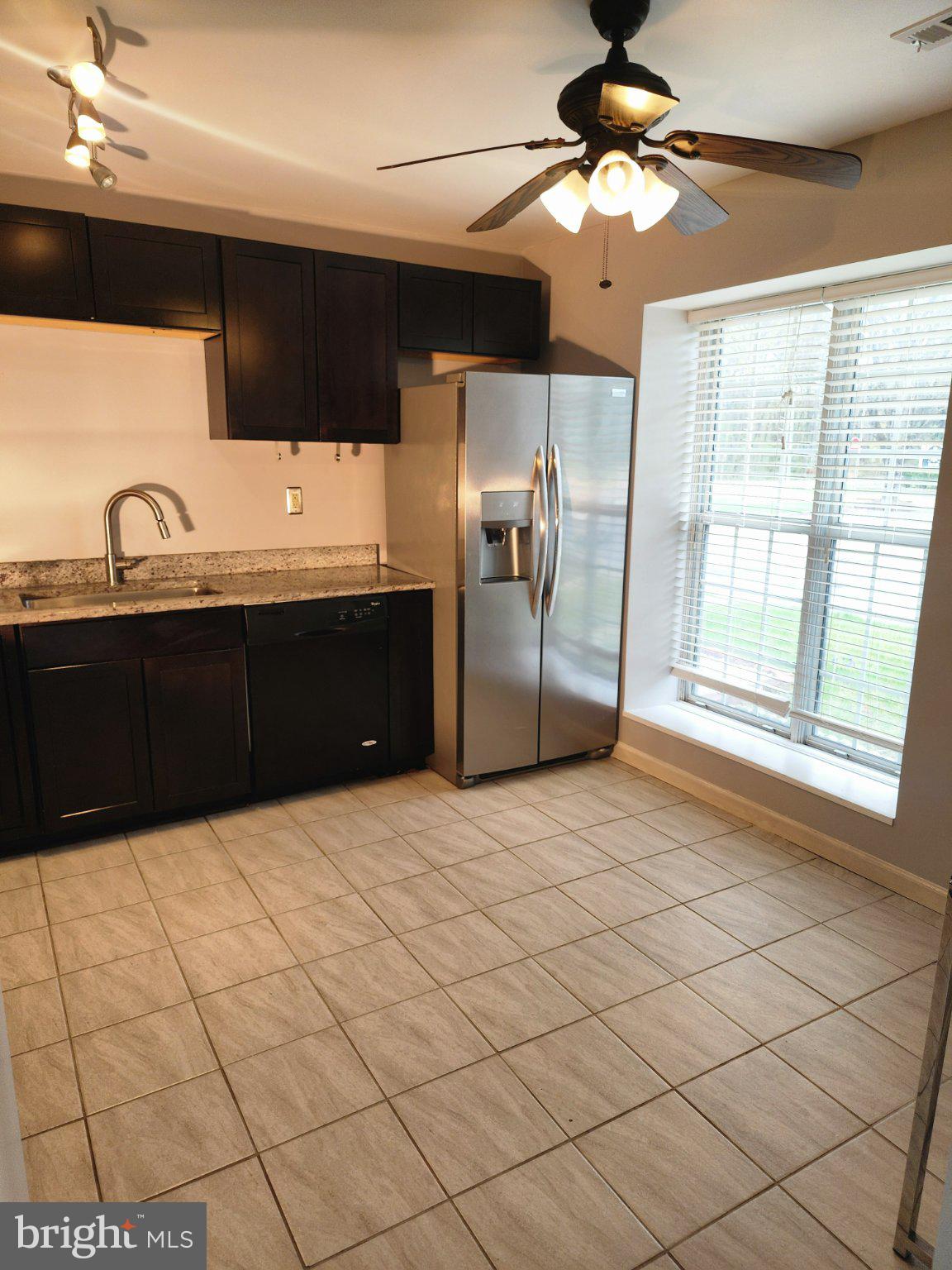 2384 Mitchellville Road Bowie, MD 20716 - Photo 10 of 44 a kitchen with stainless steel appliances a sink stove and refrigerator