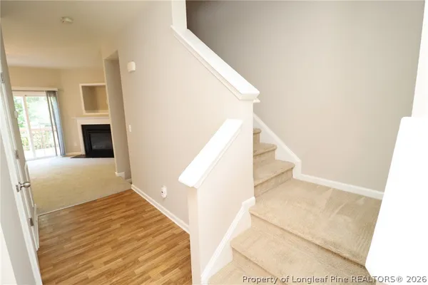a view of a living room with furniture and entryway
