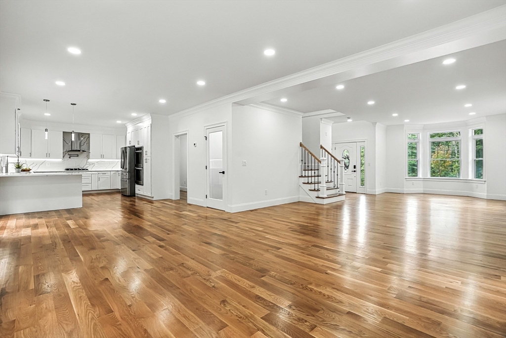 53 Cider Mill Lane Upton, MA 01568 - Photo 12 of 40 a view of a kitchen with a refrigerator and a counter top space
