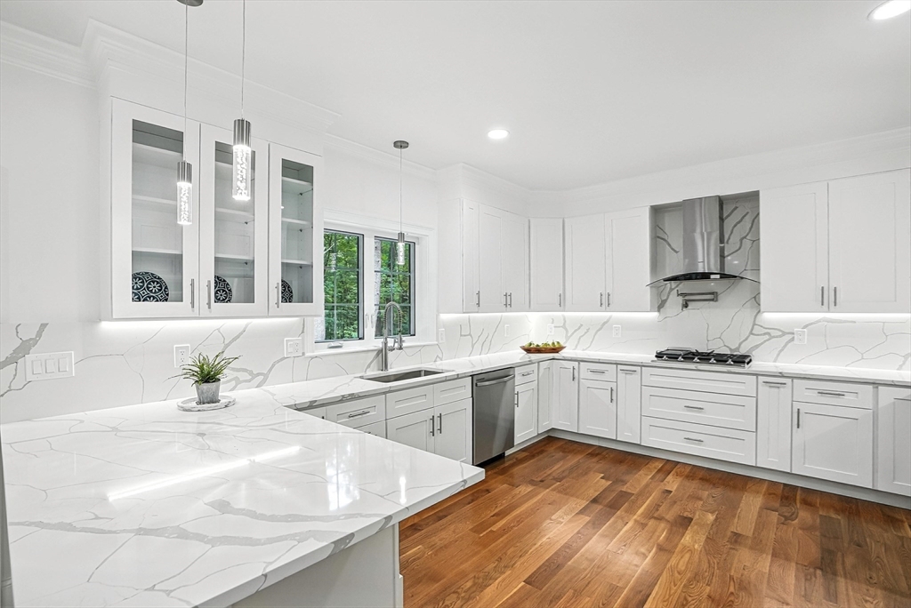 53 Cider Mill Lane Upton, MA 01568 - Photo 14 of 40 a kitchen with a sink stove and cabinets