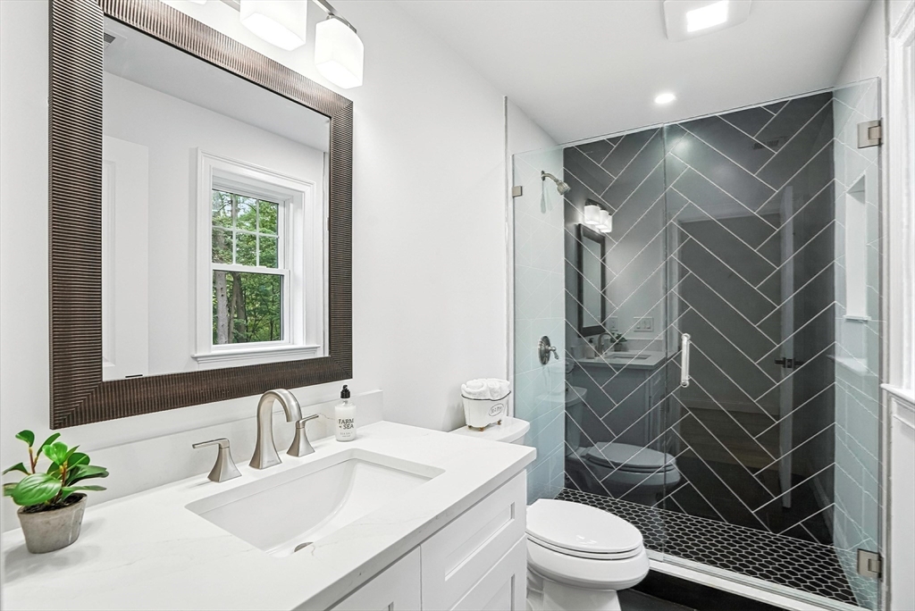 53 Cider Mill Lane Upton, MA 01568 - Photo 28 of 40 a bathroom with a sink toilet vanity and shower