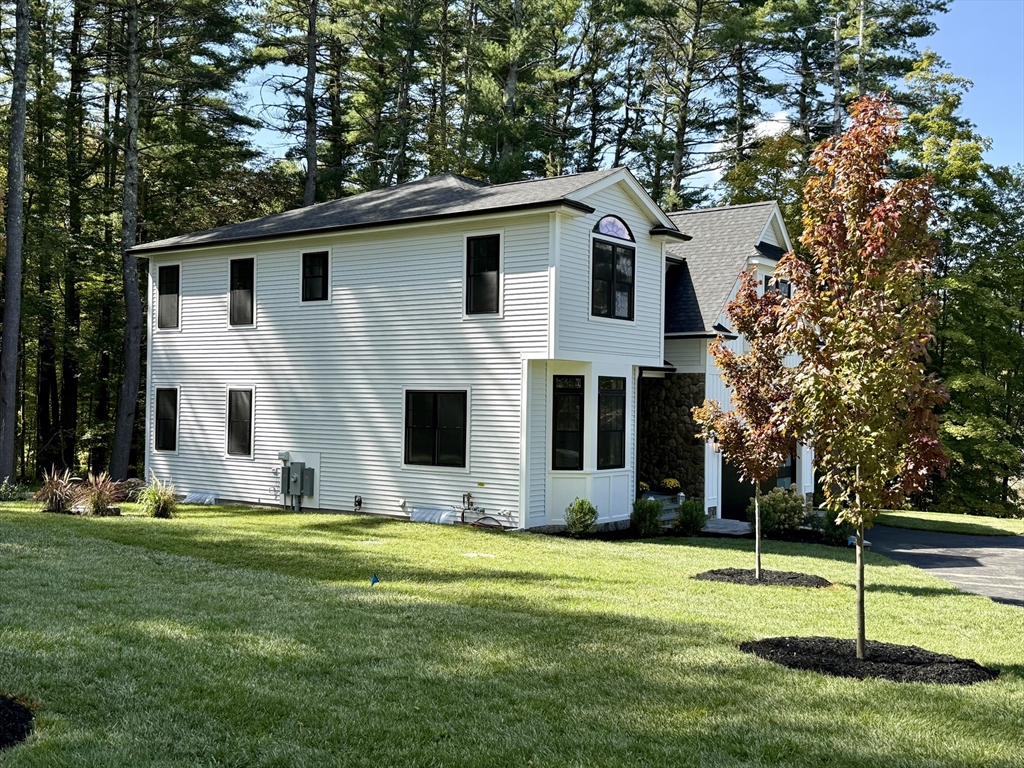 53 Cider Mill Lane Upton, MA 01568 - Photo 37 of 40 a front view of house with yard and green space