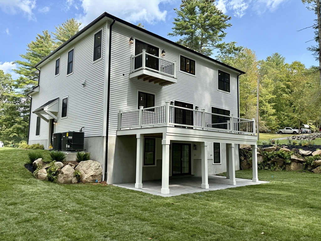 53 Cider Mill Lane Upton, MA 01568 - Photo 38 of 40 a front view of a house with a garden