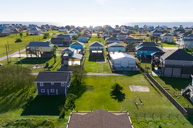 an aerial view of a house with outdoor space