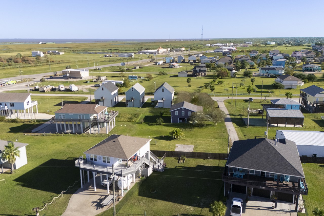 2109 1st Street Crystal Beach, TX 77650 - Photo 7 of 14 an aerial view of residential houses with outdoor space