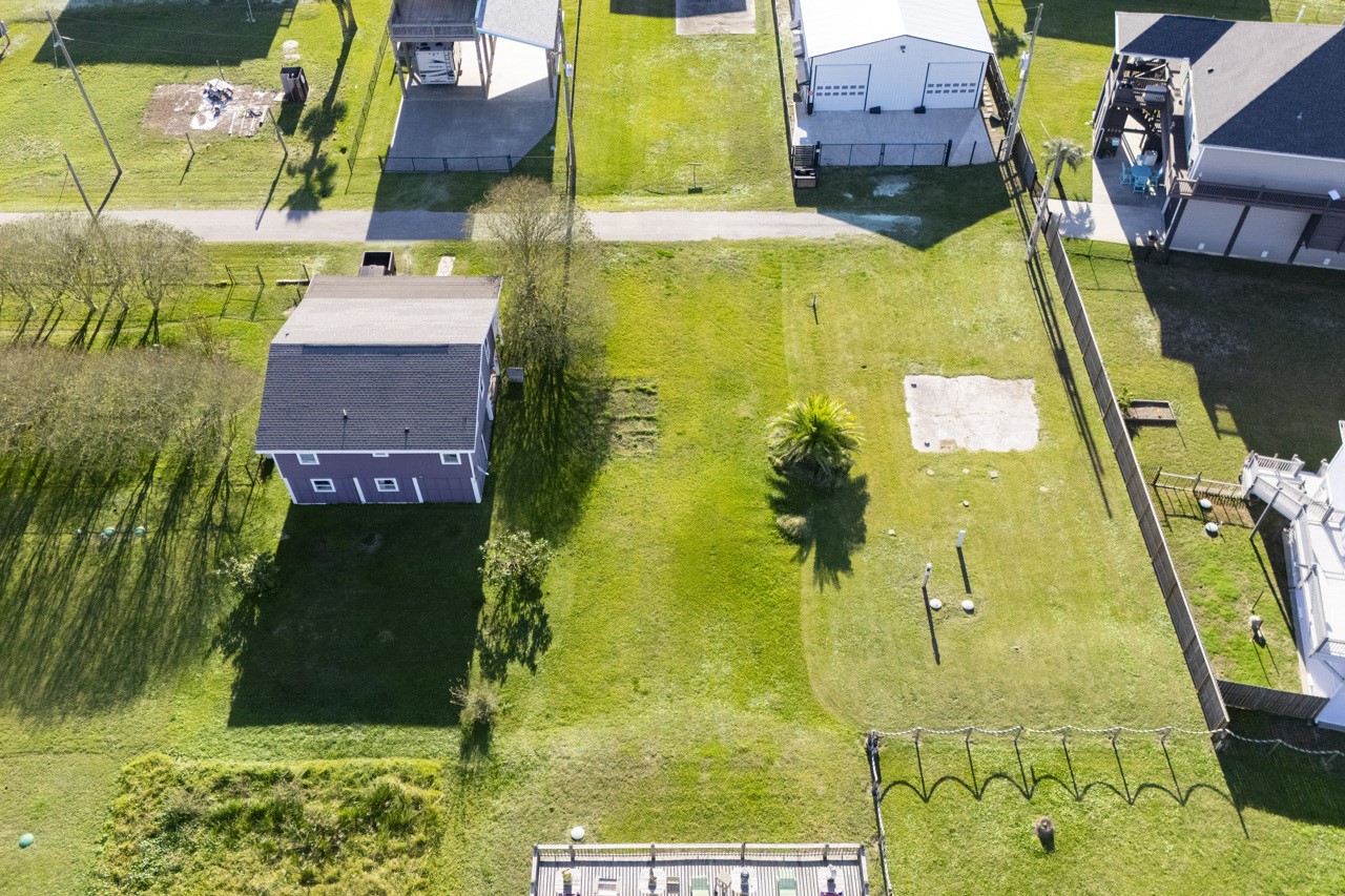 2109 1st Street Crystal Beach, TX 77650 - Photo 9 of 14 swimming pool view with garden