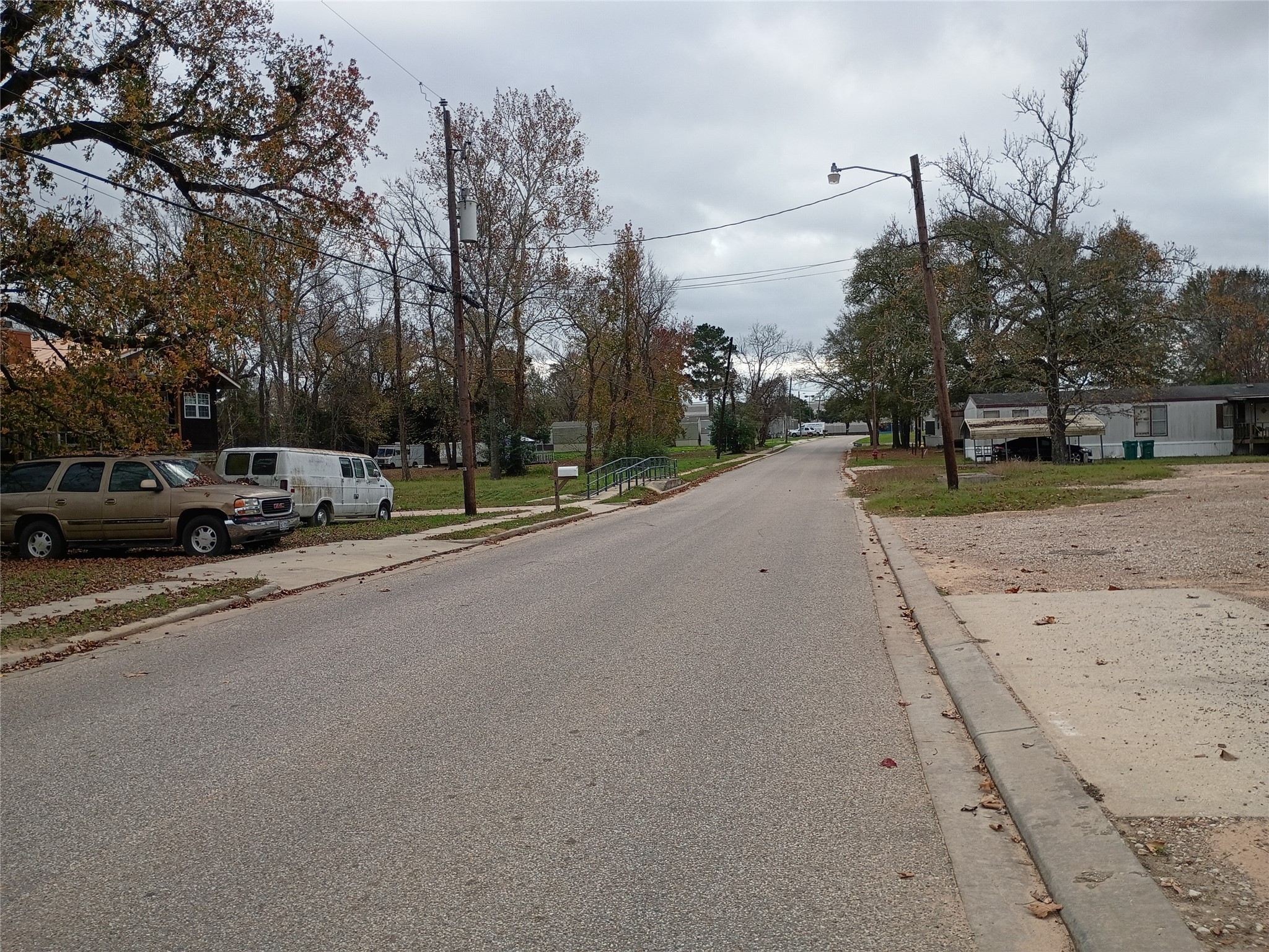 Tbd Young Street Willis, TX 77378 - Photo 3 of 12 a view of a street with a building