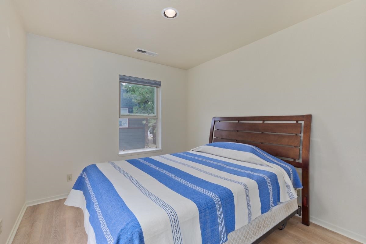 550 Mono Street, Unit C202 Mammoth Lakes, CA 93546 - Photo 14 of 36 a bedroom with a bed and window