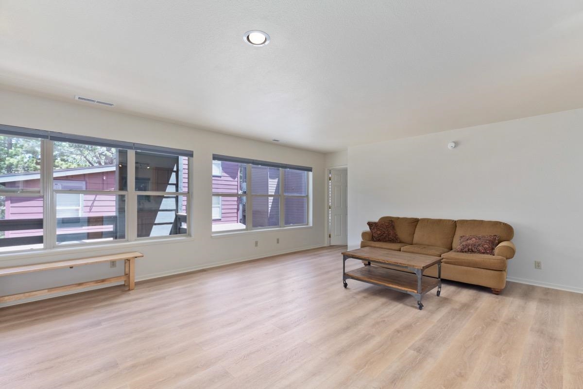 550 Mono Street, Unit C202 Mammoth Lakes, CA 93546 - Photo 3 of 36 a living room with furniture and a large window