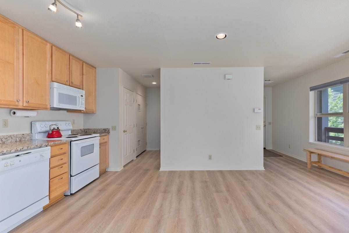 550 Mono Street, Unit C202 Mammoth Lakes, CA 93546 - Photo 5 of 36 a kitchen with a sink a stove and cabinets