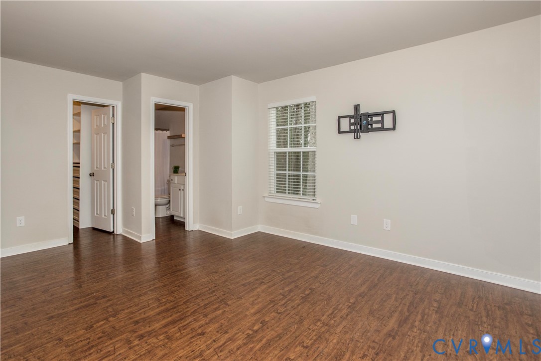 1561 Burning Tree Road Henrico, VA 23231 - Photo 12 of 29 an empty room with wooden floor and windows
