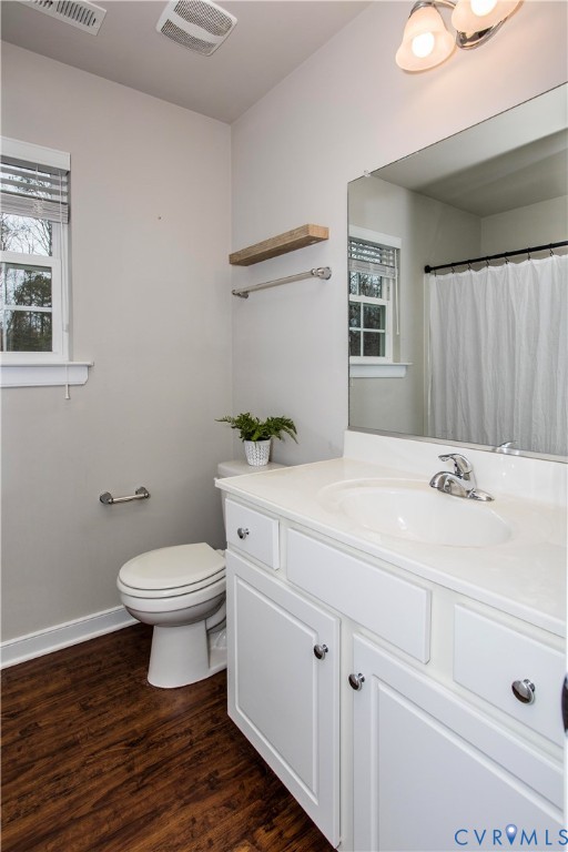 1561 Burning Tree Road Henrico, VA 23231 - Photo 16 of 29 a bathroom with a sink a toilet and mirror