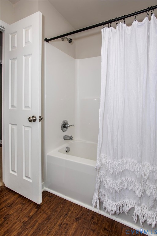 1561 Burning Tree Road Henrico, VA 23231 - Photo 17 of 29 a bathroom with a shower curtain and a bathtub