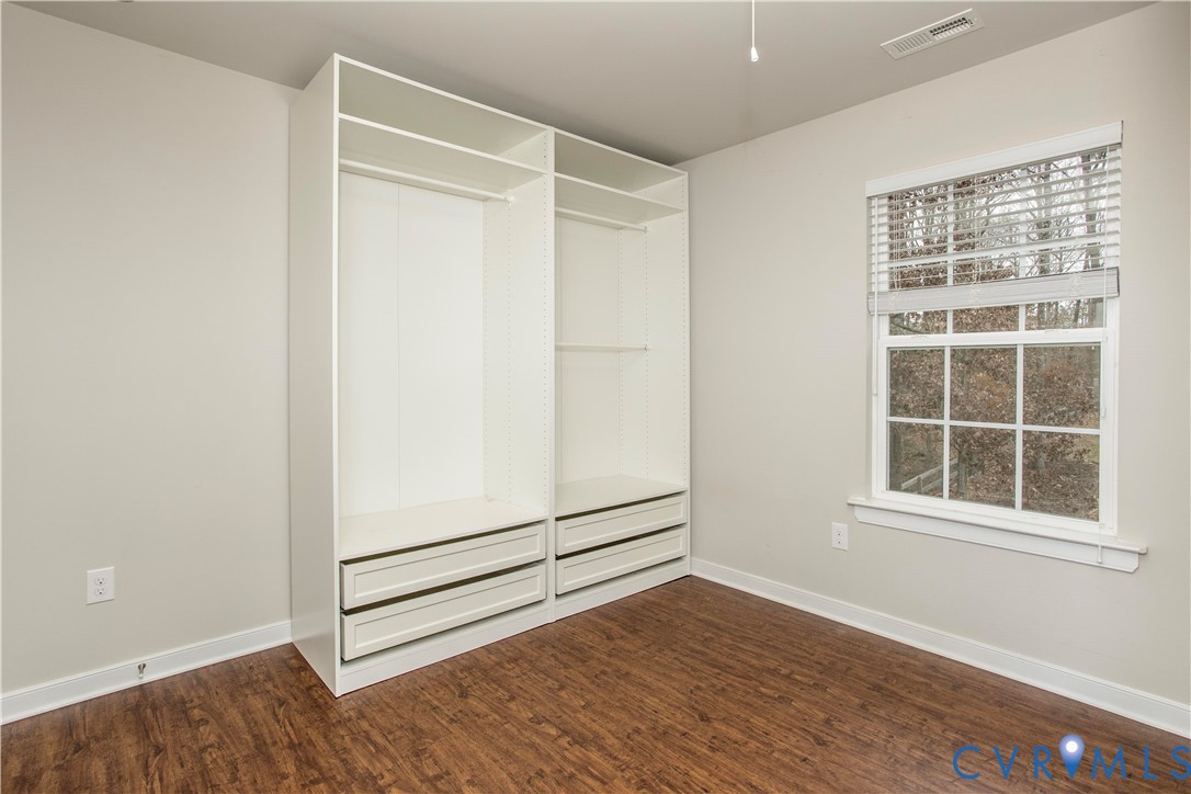 1561 Burning Tree Road Henrico, VA 23231 - Photo 18 of 29 a view of an empty room with wooden floor and a window