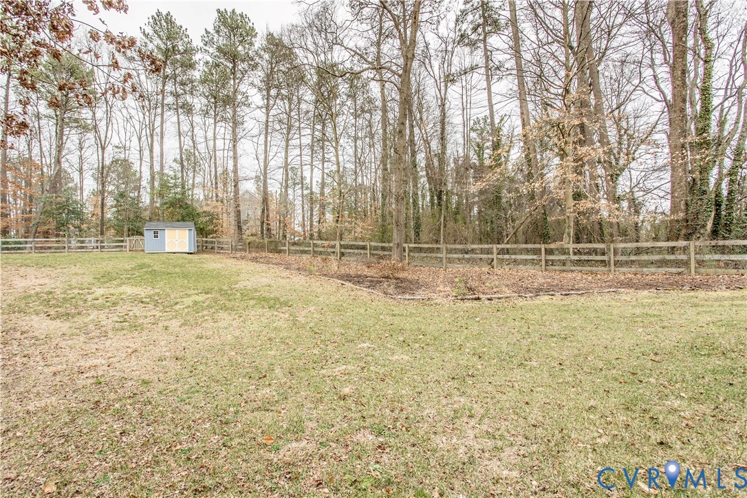 1561 Burning Tree Road Henrico, VA 23231 - Photo 22 of 29 a view of a yard with trees in the background