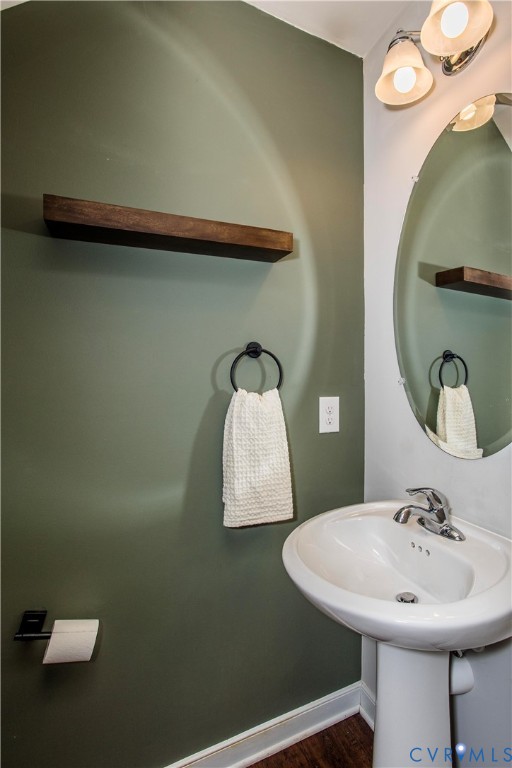 1561 Burning Tree Road Henrico, VA 23231 - Photo 9 of 29 a bathroom with a sink and mirror