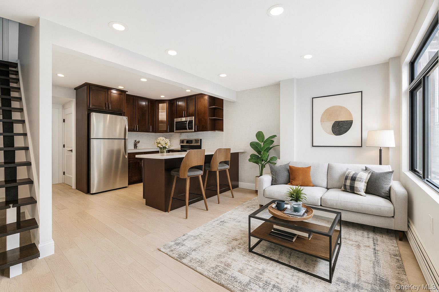 3067 Williamsbridge Road Bronx, NY 10467 - Photo 4 of 29 a living room with stainless steel appliances furniture and a kitchen view