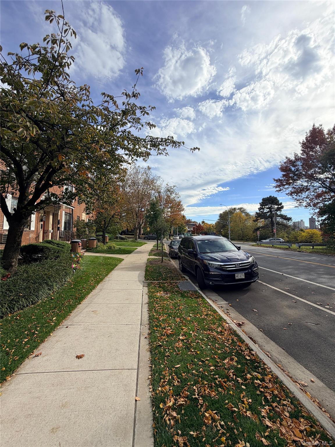 71-43 Park Drive East, Unit A Queens, NY 11367 - Photo 6 of 6 View of asphalt street featuring sidewalks and curbs