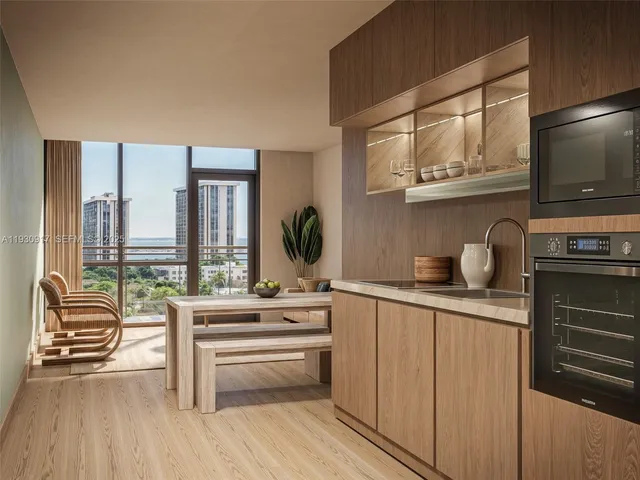 a kitchen with stainless steel appliances a sink and cabinets