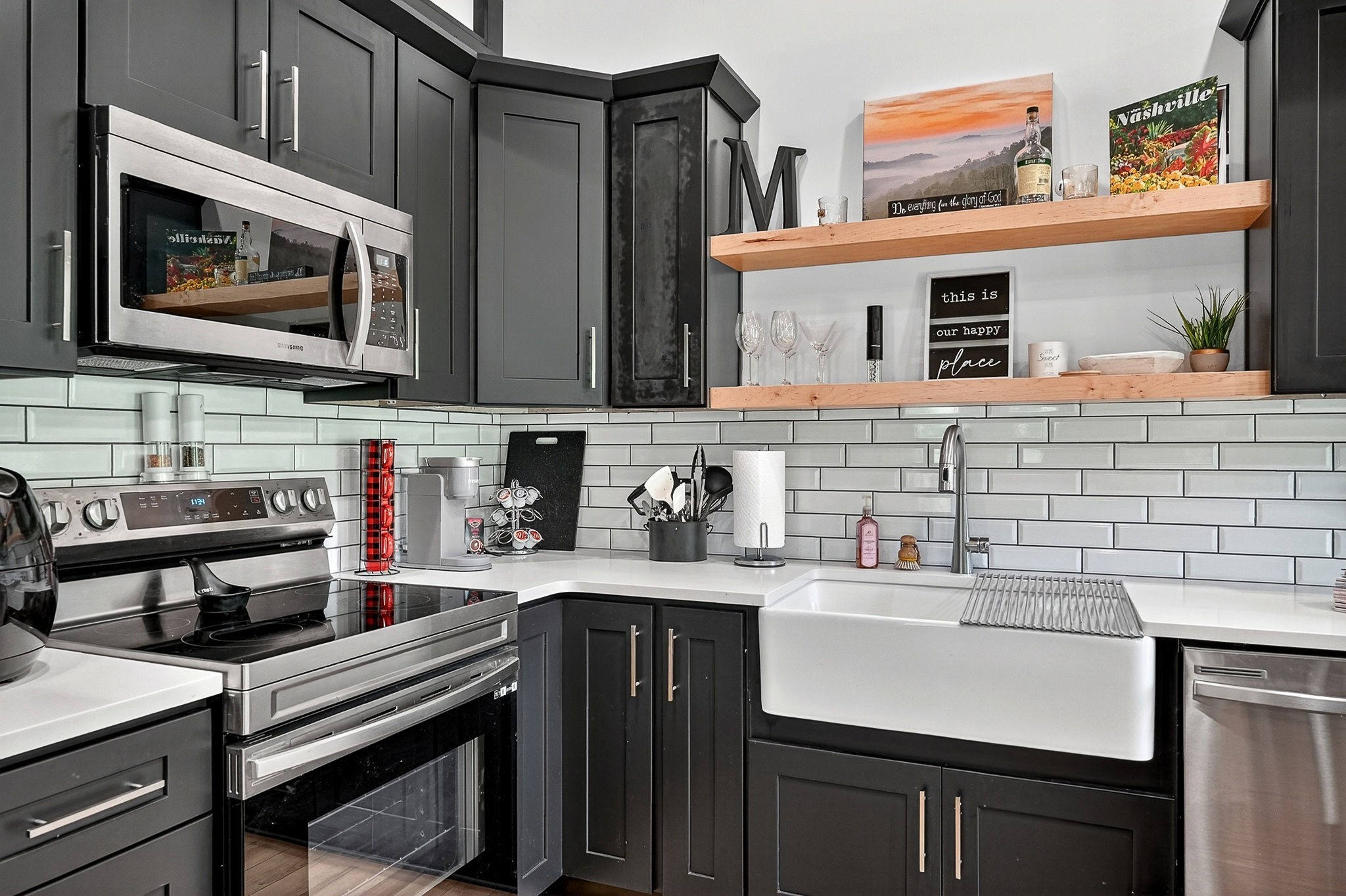 99 Judkins Road Hickman, TN 38567 - Photo 7 of 62 a kitchen with stainless steel appliances a sink a stove and cabinets
