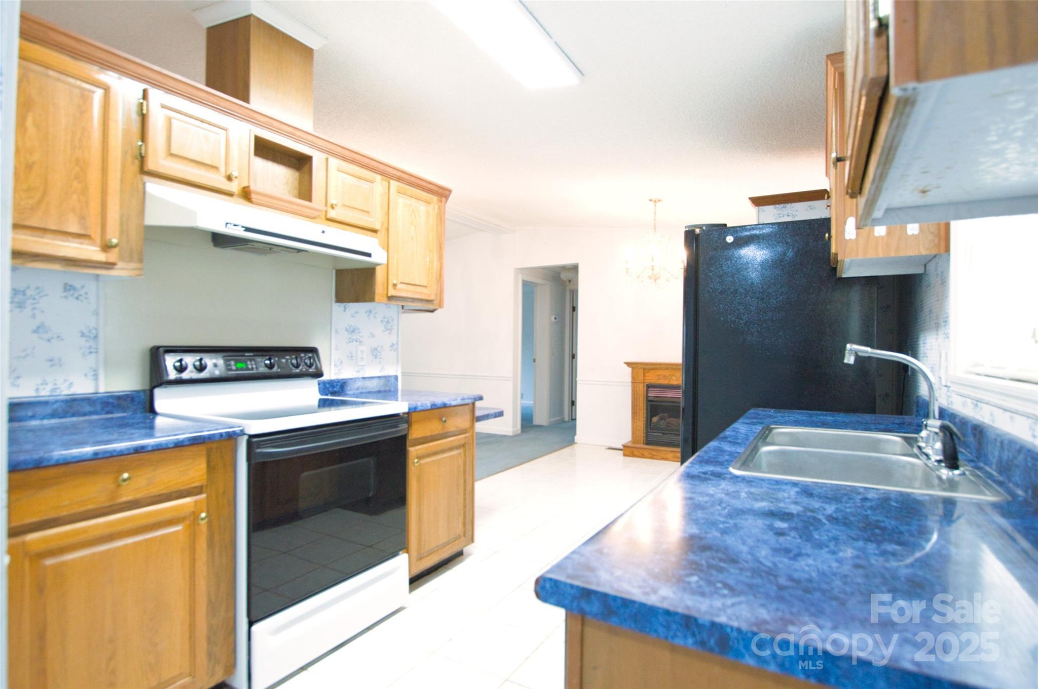 150 Orindawood Road McConnells, SC 29726 - Photo 12 of 21 a kitchen with stainless steel appliances granite countertop a sink and a stove