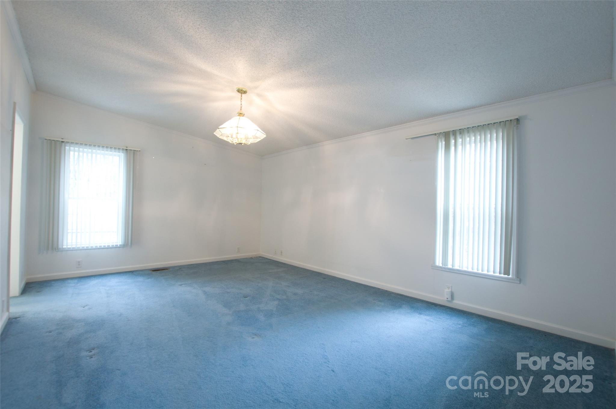 150 Orindawood Road McConnells, SC 29726 - Photo 13 of 21 an empty room with chandelier fan and windows