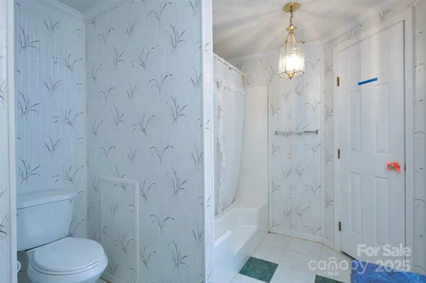 a view of a chandelier in big room