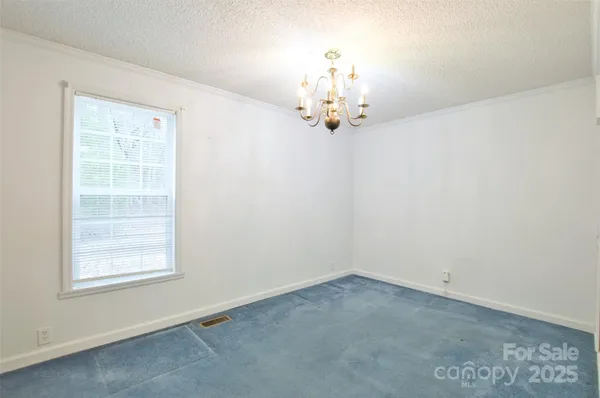 a view of a chandelier in big room