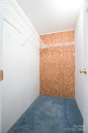 a bathroom with a granite countertop sink toilet a mirror and shower
