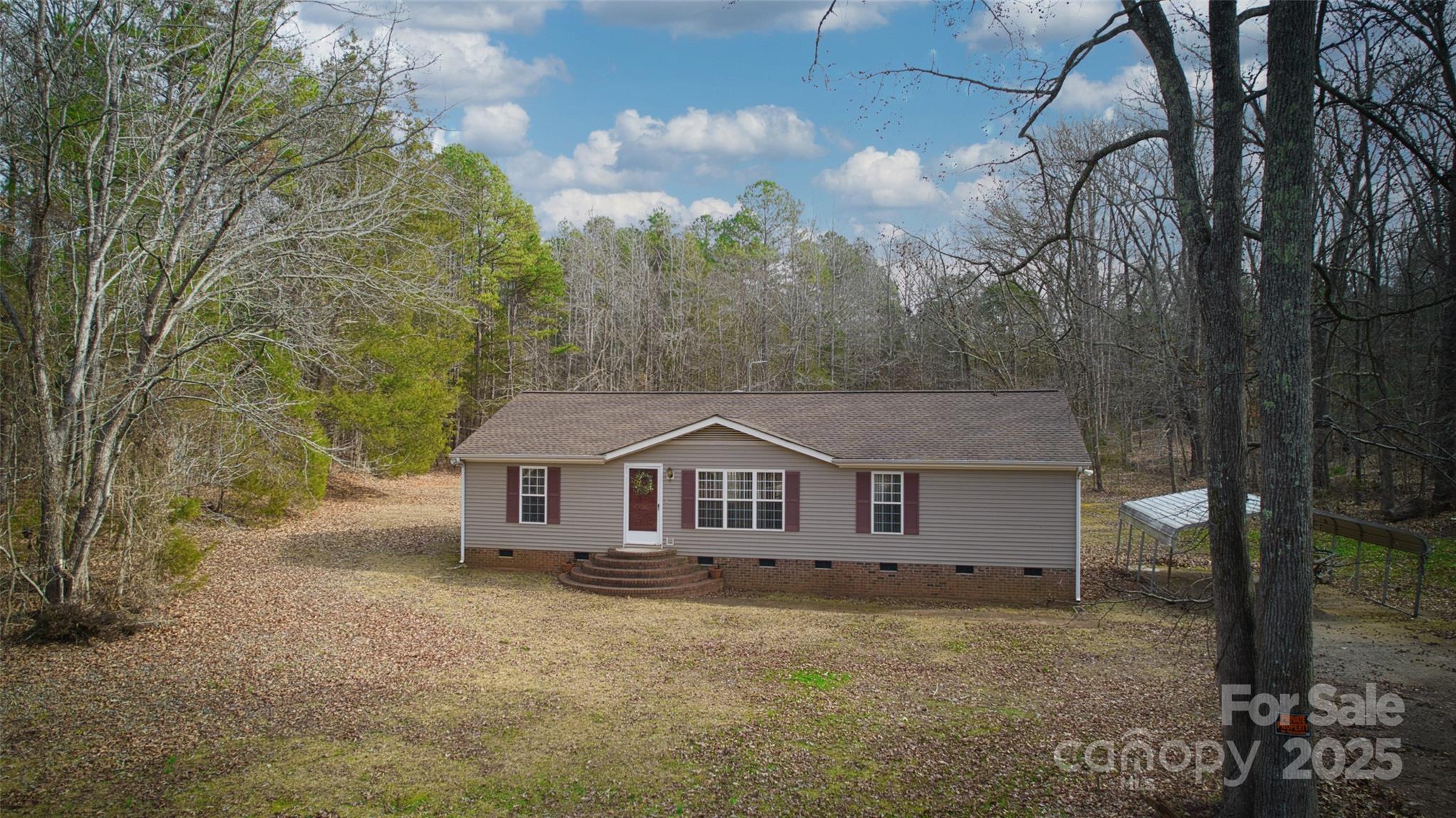 150 Orindawood Road McConnells, SC 29726 - Photo 2 of 21 a view of a house with a big yard and large tree