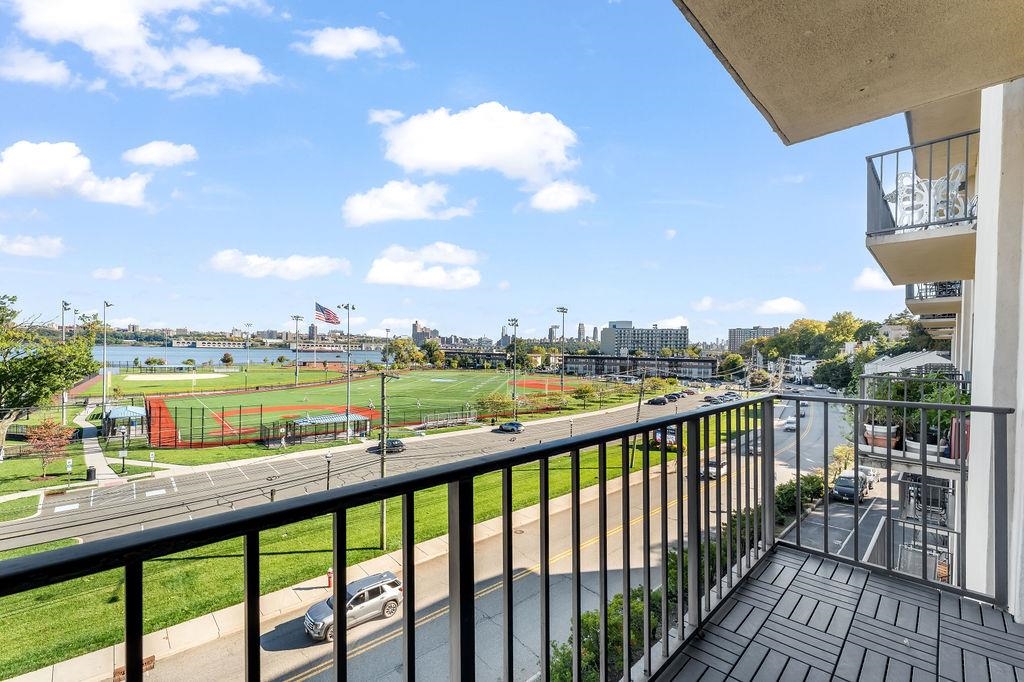 1150 River Road, Unit 4F Edgewater, NJ 07020 - Photo 3 of 20 a view of city from a balcony