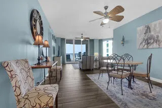 a view of a dining room with furniture and wooden floor