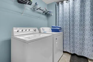 a utility room with dryer and washer