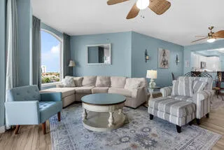 a living room with furniture and a large window