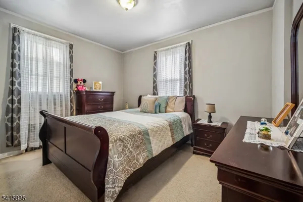 a bedroom with bed and window