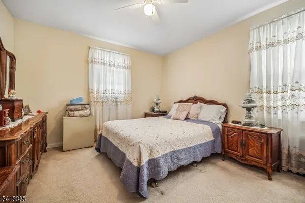 a bed room with a bed and a window