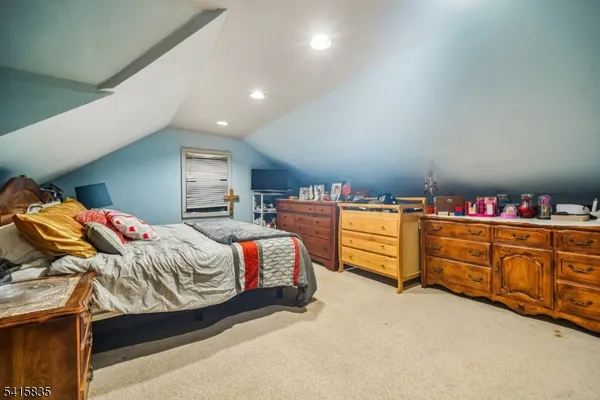 a bedroom with bed and window