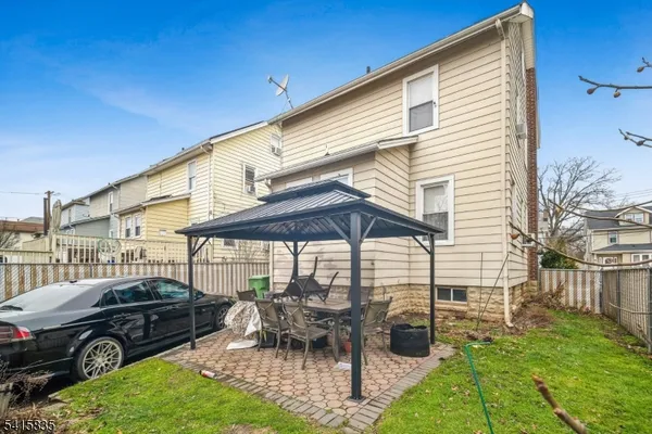a patio with table and chairs