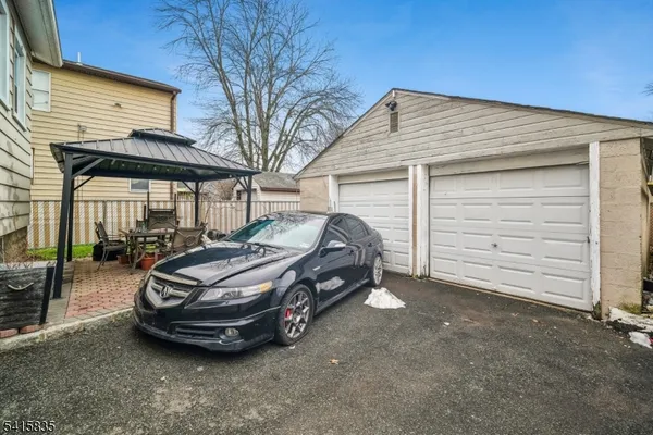 a car parked in front of white house