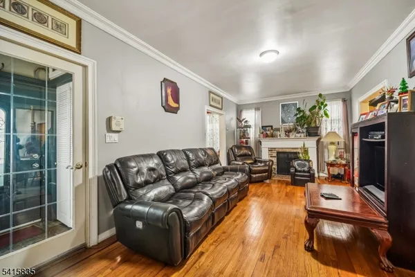 a living room with fireplace furniture and a flat screen tv