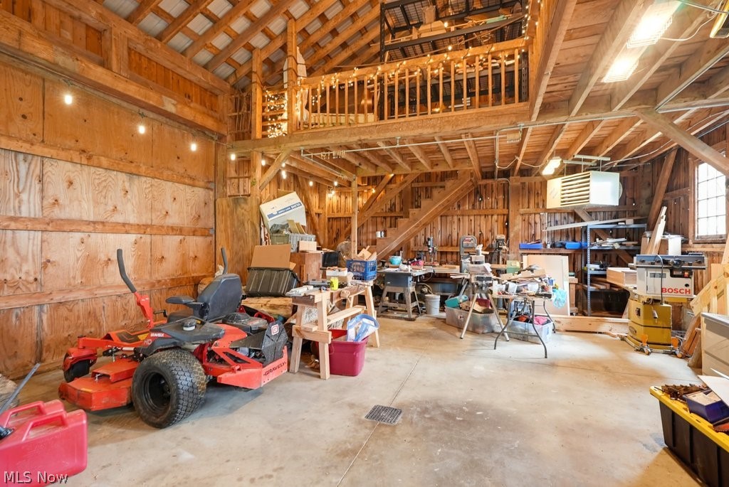 149 North Medina Line Road Akron, OH 44333 - Photo 27 of 42 Barn structure with exposed wood framing, concrete flooring, and a second-story loft