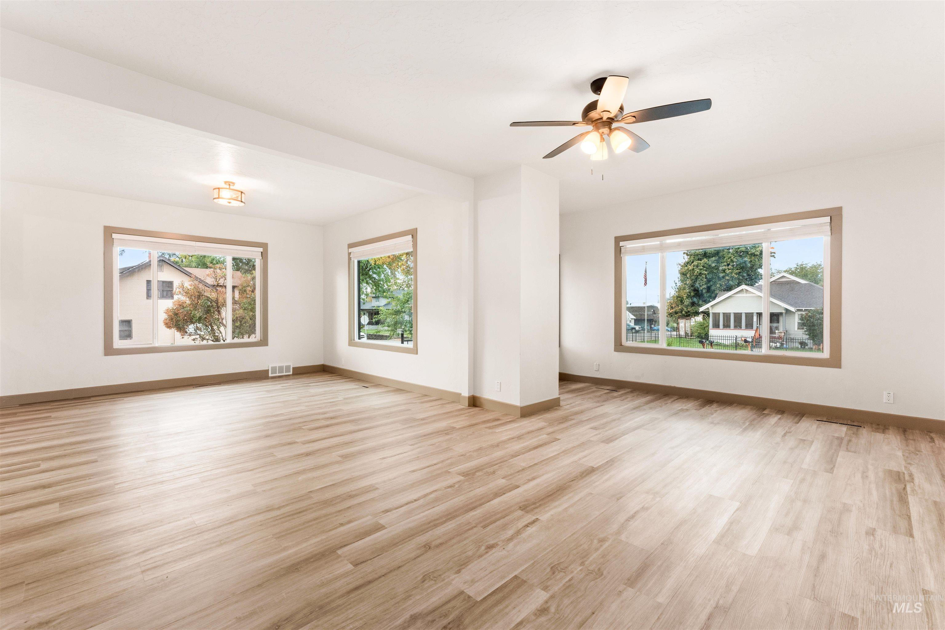 602 North 5th Street Parma, ID 83660 - Photo 14 of 48 Unfurnished living room with light wood-style flooring and ceiling fan