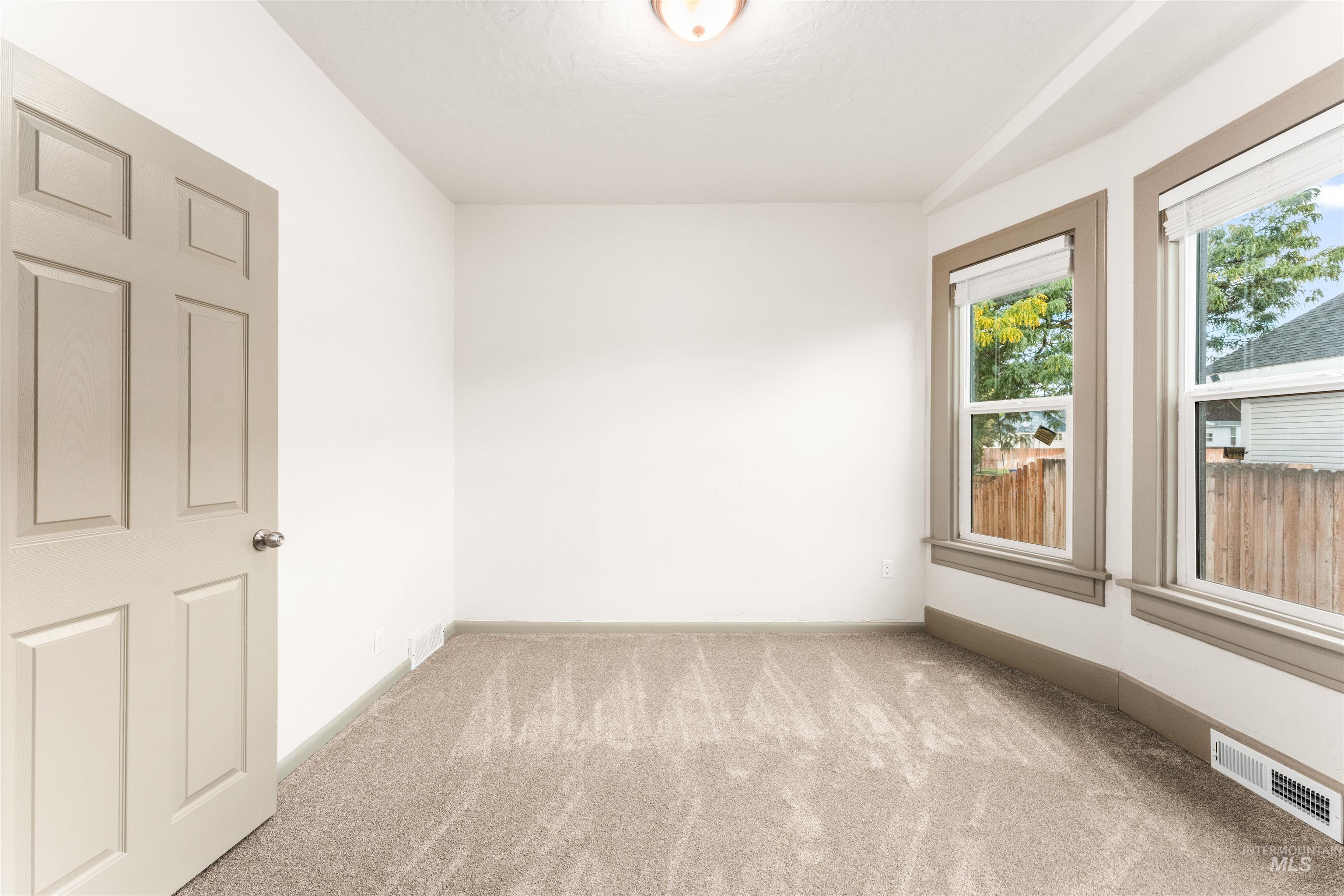 602 North 5th Street Parma, ID 83660 - Photo 23 of 48 Spare room with light carpet and baseboards