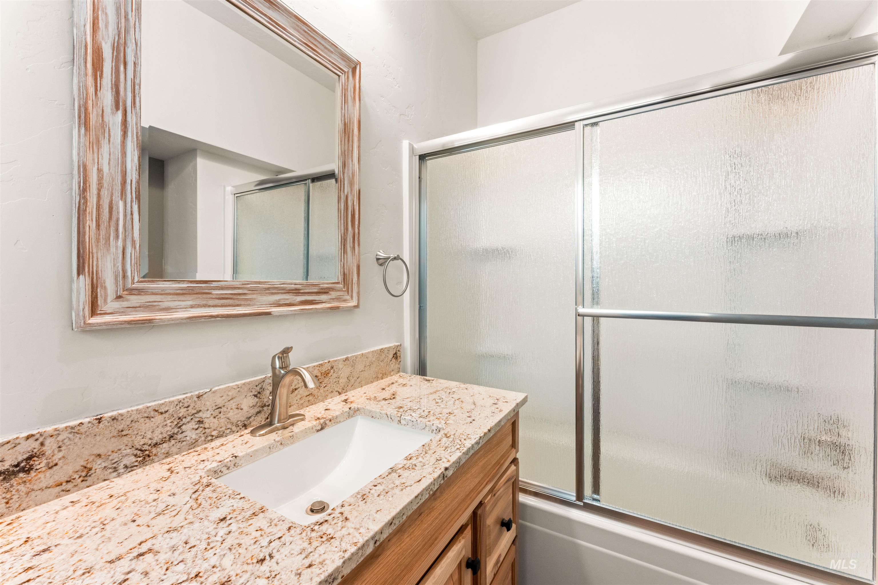 602 North 5th Street Parma, ID 83660 - Photo 26 of 48 Full bathroom with vanity and shower / bath combination with glass door