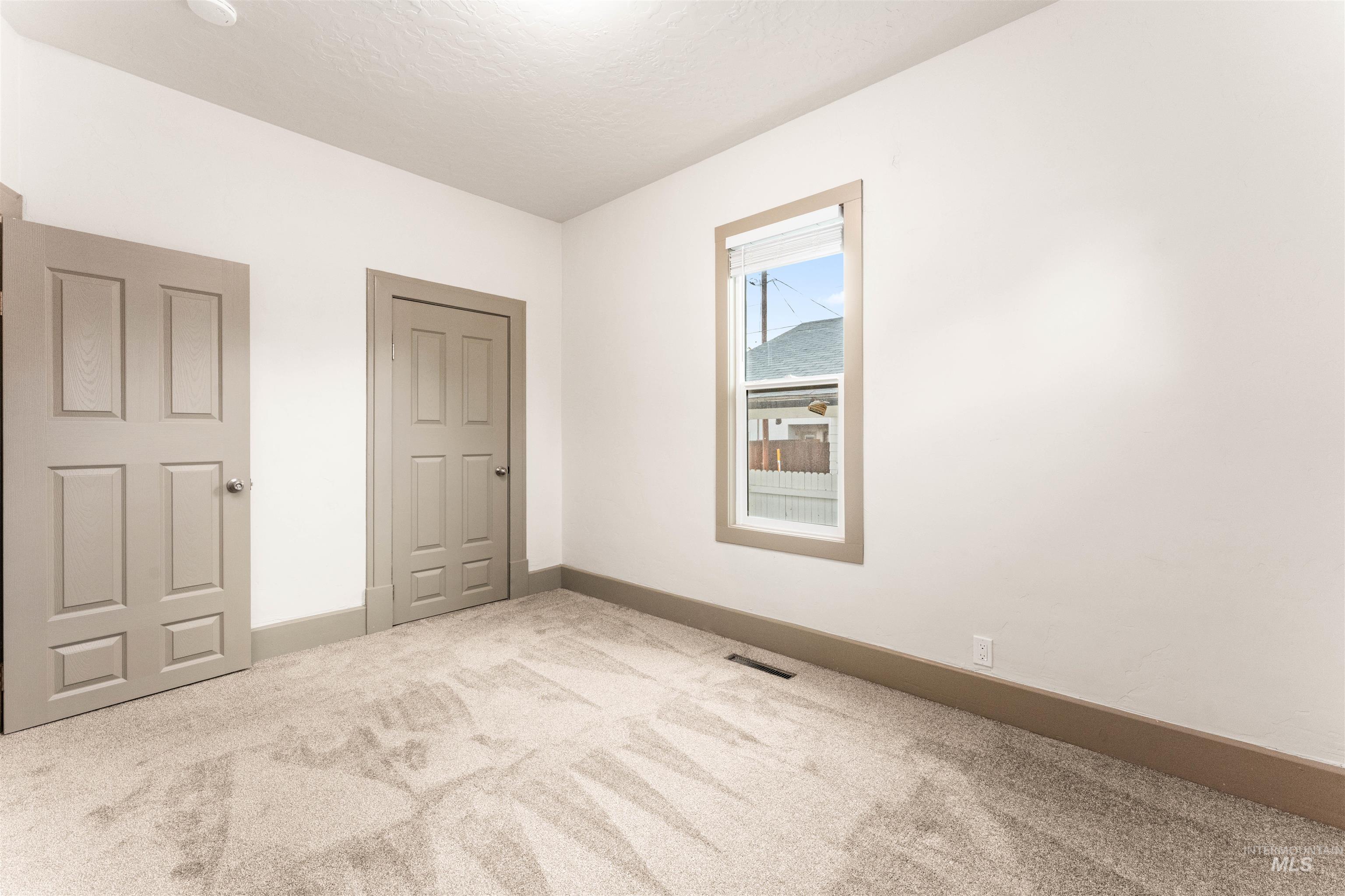 602 North 5th Street Parma, ID 83660 - Photo 33 of 48 Unfurnished bedroom with carpet flooring and baseboards